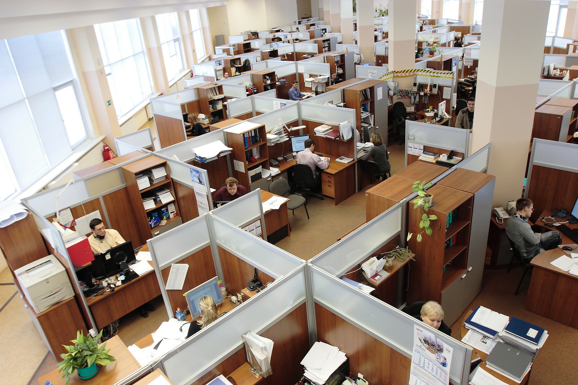 aerial view of an office with desks and people working